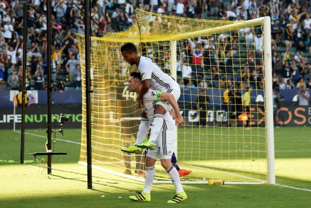 Robbie Keane of Los Angeles Galaxy celebrates his goal with teammate Giovani dos Santos du