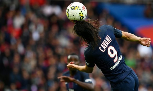 Paris Saint-Germain's forward Edinson Cavani heads the ball during the French L1 football