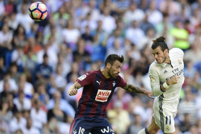 Eibar's defender Antonio Luna (L) clashes with Real Madrid's forward Gareth Bale on Octobe