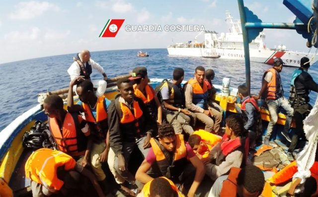 Italian coast guard personnel rescue migrants in the Mediterranean Sea on August 30, 2016