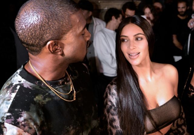 Kanye West and Kim Kardashian (right) attend a fashion show in Paris on September 29, 2016