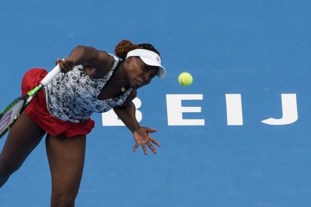 Venus Williams of the US serves against China's Peng Shuai during their women's singles fi
