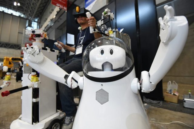 A prototype remote-controlled robot called "Caiba" is demonstrated by developer Katsumori