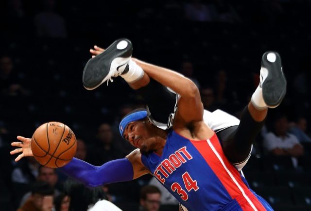 Tobias Harris of the Detroit Pistons and Trevor Booker of the Brooklyn Nets collide going