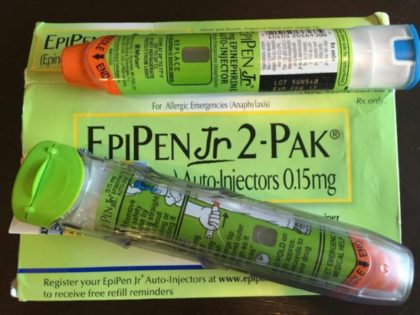 The settlement with the Department of Justice and other regulators resolves questions about Mylan's classification of EpiPen as a generic drug, Mylan said
