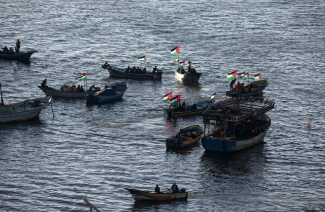 Palestinians sail boats in the port of Gaza City in support of the flotilla of internation
