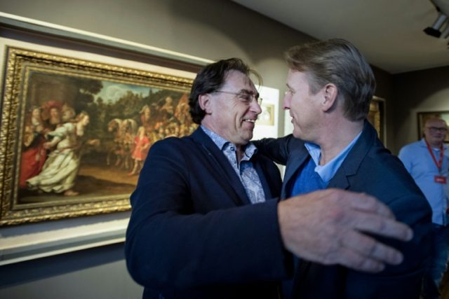 Westfries Museum director Ad Geerding (L) and art detective Arthur Brand (R) celebrate aft