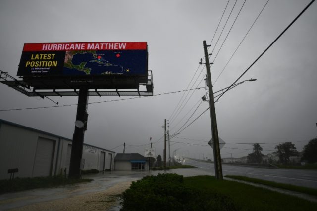 Hurricane Matthew has been downgraded to a Category Three storm by the National Hurricane