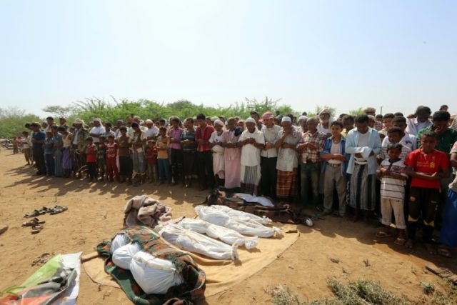 Yemenis attend the funeral of members of the same family on October 8, 2016, a day after t