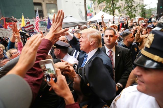 Donald Trump greets supporters outside Trump Tower, on the 5th Avenue in Manhattan, New Yo
