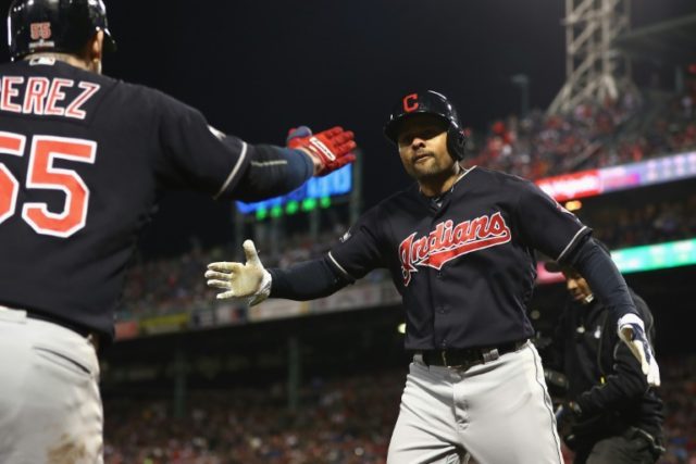 Coco Crisp of the Cleveland Indians celebrates with teammate Roberto Perez after hitting a