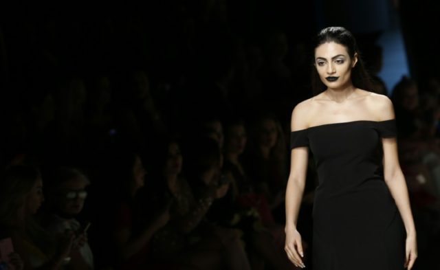 Emirati model Rafeea Al-Hajsi presents a creation by Lebanese designer Aiisha Ramadan duri