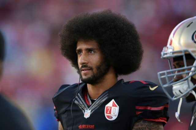 Colin Kaepernick #7 of the San Francisco 49ers stands on the sidelines during their NFL ga