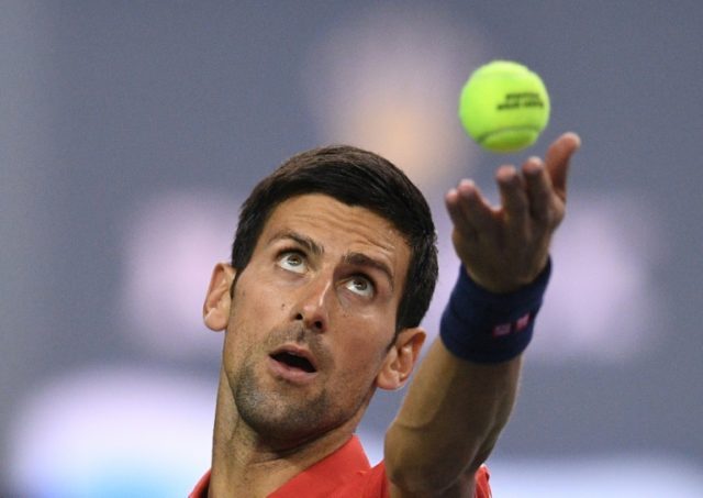 World number one Novak Djokovic serves against Fabio Fognini of Italy at the Shanghai Mast