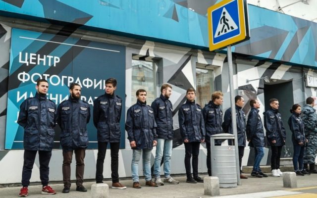 Activists from a non-governmental organisation called "Officers of Russia" stand outside t
