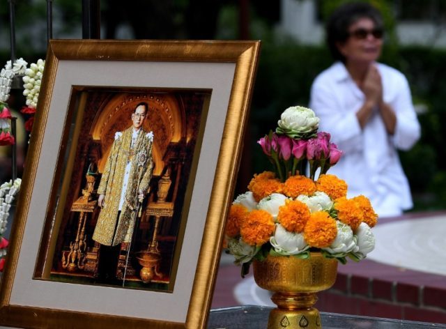 A woman mourns the death of Thailand's King Bhumibol Adulyadej at Bangkok's Siriraj Hospit