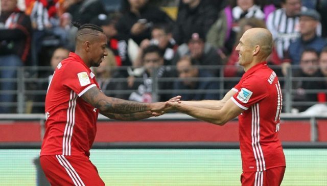 Arjen Robben (right) celebrates with Jerome Boateng after scoring for Bayern Munich agains