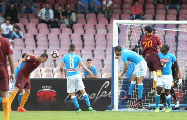 Edin Dzeko (left) scores for Roma against Napoli on October 15, 2016 at the San Paolo stad