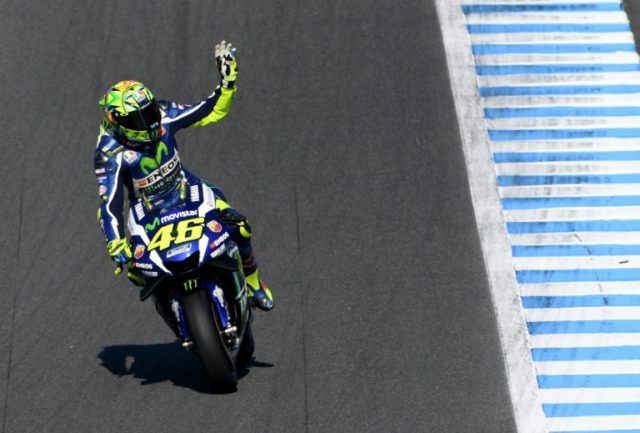 Valentino Rossi waves to spectators during the MotoGP practice session at the Japanese Gra