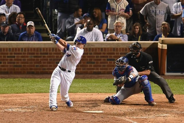 Miguel Montero of the Chicago Cubs hits a grand slam home run in the eighth inning against
