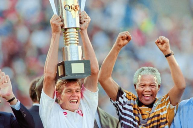 Neil Tovey celebrates with Nelson Mandela in 1996 after South Africa won the Africa Nation