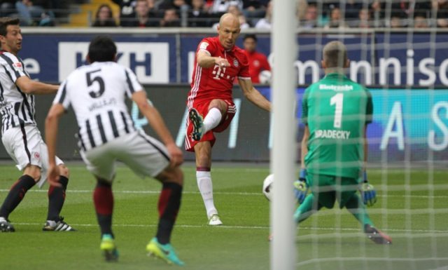 Arjen Robben (centre) scores an opening goal for Bayern Munich against Eintracht Frankfurt