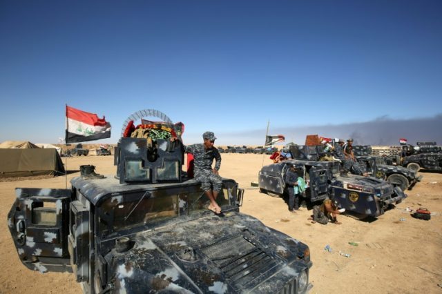Iraqi forces gather at the Qayyarah military base, about 60 kilometres (35 miles) south of