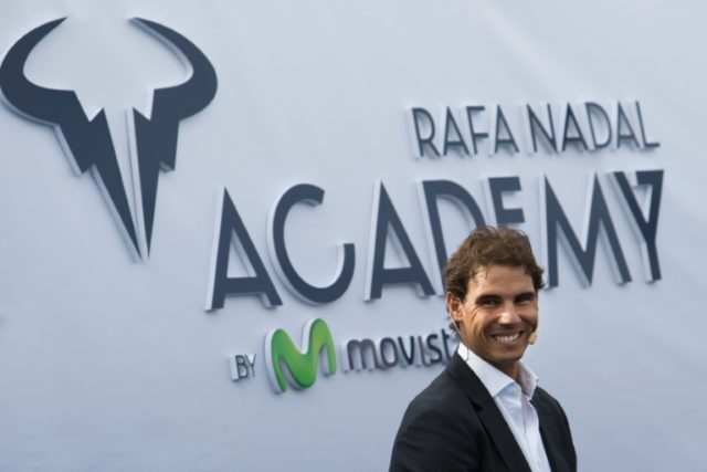 Spanish tennis player Rafael Nadal smiles during the opening of the Rafa Nadal Academy in