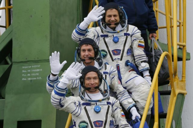 Russian cosmonauts Sergei Ryzhikov (bottom) and Andrei Borisenko (top) and US astronaut Sh