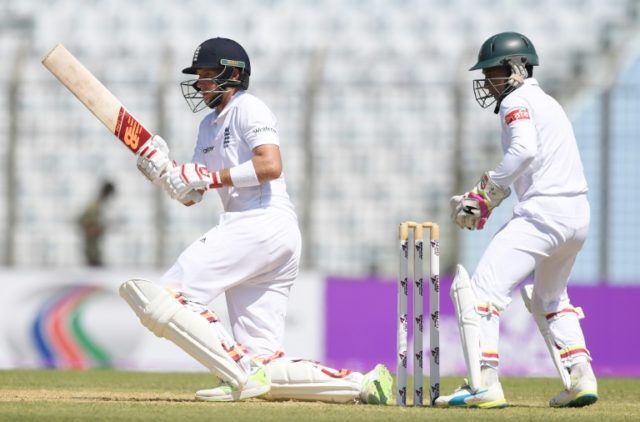 England's Joe Root plays a shot in front of Bangladesh' captain Mushfiqur Rahim during the