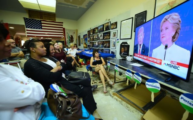 People watch the third and final presidential debate on October 19, 2016 in Pasadena, Cali