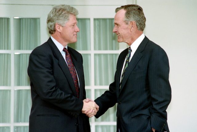 US President George Bush (R) shakes hands with President-elect Bill Clinton on November 18