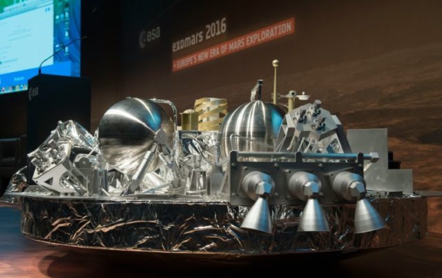 A scale model of the Schiaparelli landing unit that will scour the Red Planet for signs of