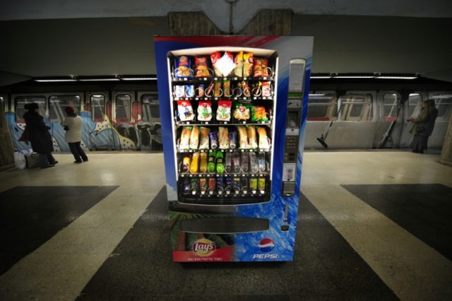 A junk food machine in a subway station is shown in Romania in 2010, where the population