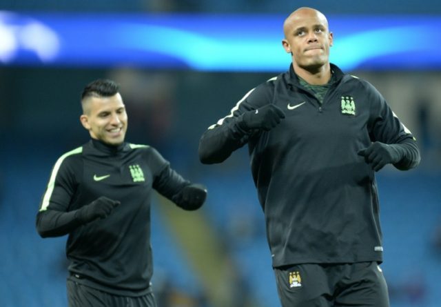 Manchester City's Sergio Aguero (left) and Vincent Kompany warm up ahead of a Champions Le
