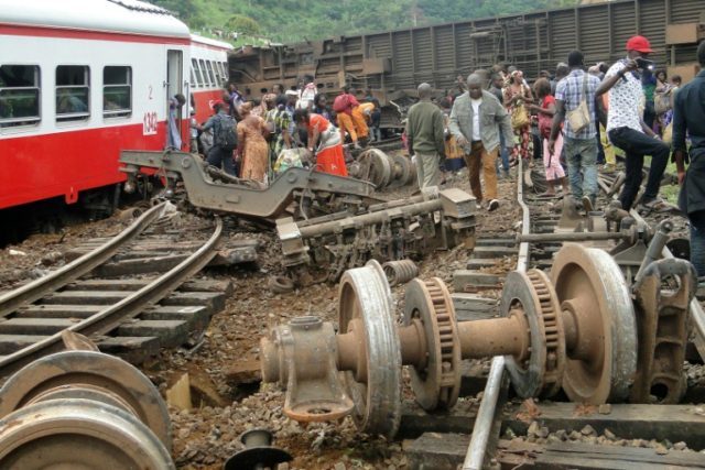 Passengers escape the site of a train derailment in Eseka, Cameroon, which left at least 6
