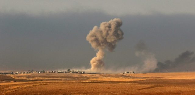 Smoke billows from an area near the Iraqi town of Bashiqa, some 25 kilometres north east o