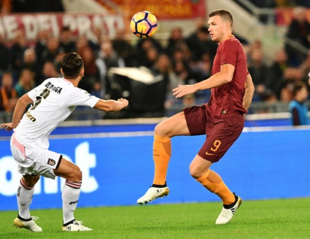 Roma's forward Edin Dzeko (R) faces off with Palermo's defender Edoardo Goldaniga on Octob