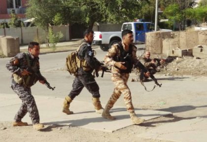 Iraqi Kurdish security forces patrol a street in the southern suburbs of Kirkuk after jiha