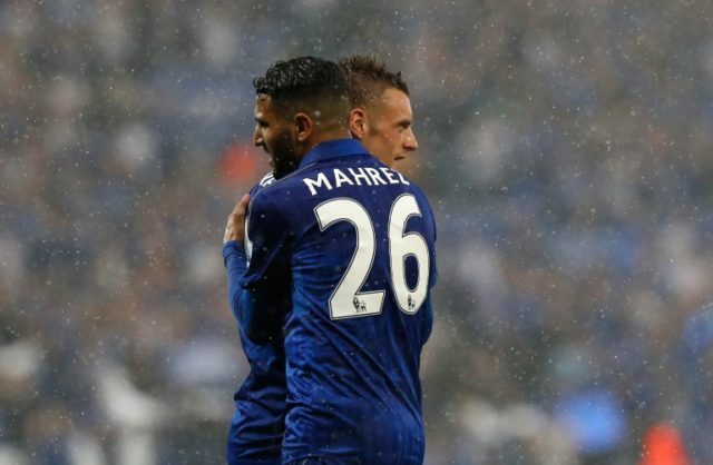 Leicester City's midfielder Riyad Mahrez (L) embraces striker Jamie Vardy during an Englis