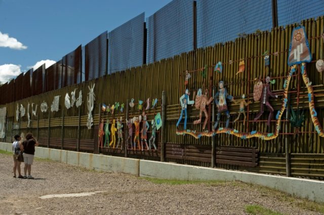 The US-Mexico border fence, seen from Nogales, Mexico's Sonora state