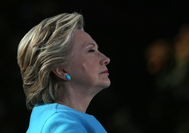 Democratic presidential nominee former Secretary of State Hillary Clinton looks on during a campaign rally at Saint Anselm College on October 24, 2016 in Manchester, New Hampshire