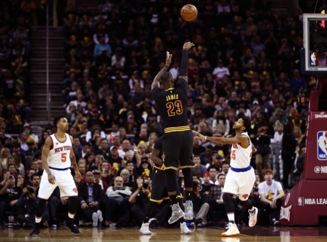LeBron James #23 of the Cleveland Cavaliers shoots in the first quarter against Derrick Ro