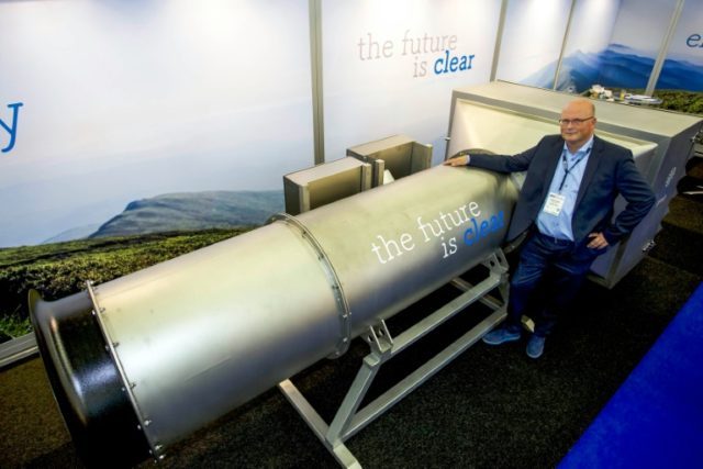 One of the group's Managing Partner Peter van Wees posing next to a system he created to f