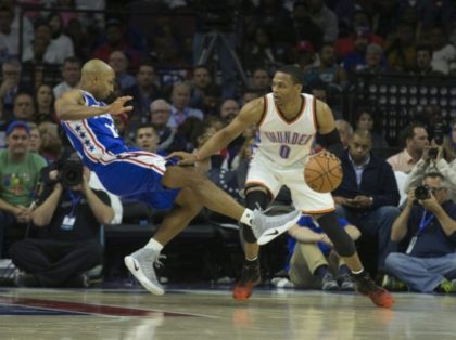 Russell Westbrook #0 of the Oklahoma City Thunder drives into Gerald Henderson #12 of the Philadelphia 76ers in the second quarter at Wells Fargo Center in Philadelphia, Pennsylvania