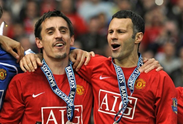 Gary Neville (L) and Ryan Giggs celebrate winning the Premiership with Manchester United i