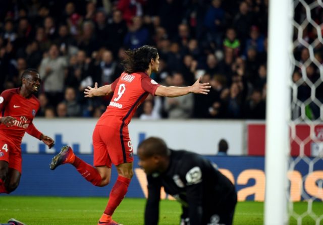 Paris Saint-Germain's Uruguayan forward Edinson Cavani jubilates after scoring during the