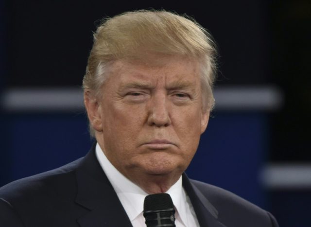 Republican presidential candidate Donald Trump listens during the second presidential deba