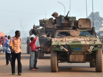 French Sangaris forces patrol in Bangui, central African Republic in February 2016 as peop
