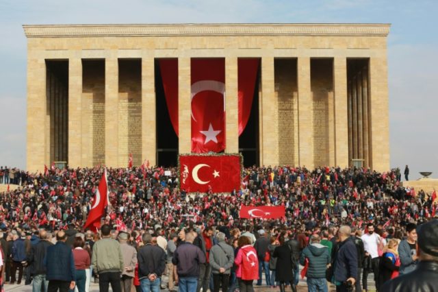 People wave Turkish flags at the Anitkabir, the mausoleum of the founder of Turkish Republ